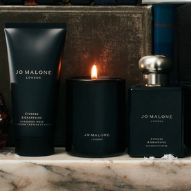 Jo Malone Cypress & Grapevine Travel Kit Gift Set featuring body wash, scented candle and cologne intense on marble surface