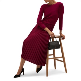Model wearing Hobbs calla pink ribbed knit midi dress with pleated skirt, styled with black heels and black handbag