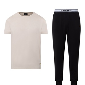 Lyle & Scott Black Pyjamas Set with cream crew-neck tee and black joggers featuring logo waistband, laid flat.