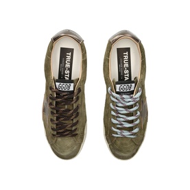 Golden Goose Super-Star trainers in olive green suede with star detail, cream sole, and waxed laces, overhead view