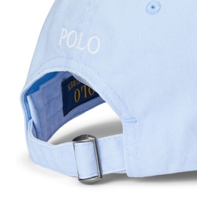 Ralph Lauren Polo cap in elite blue, white embroidered logo, silver adjustable back clasp, contrast blue undervisor lining visible.