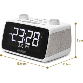 Roberts Ortus 4 FM Dual Alarm Clock Radio in white, with LED display showing dimensions: 15.8cm wide, 10.1cm deep, 9cm tall.