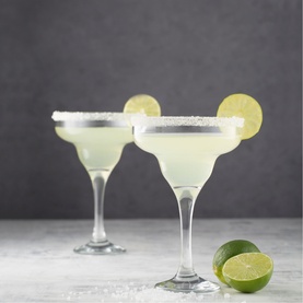 Ravenhead Set of Two Entertain Margarita Glasses, clear, filled with margarita, salted rims, lime garnish, elegant stem design.