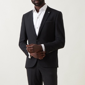 Model wearing Remus Luca Single-Breasted Suit Jacket in black with notched lapels, styled with matching trousers and white dress shirt.