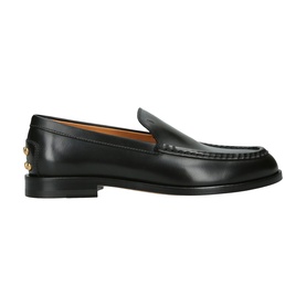 Black leather loafer with smooth finish, apron toe, and gold-tone hardware detail at heel, on a flat leather sole