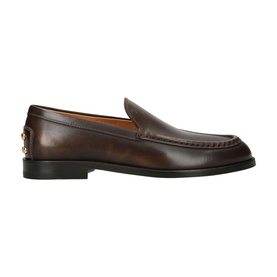Tod's brown leather loafer with moc toe stitching, slim profile, and gold hardware detail at heel, black rubber sole