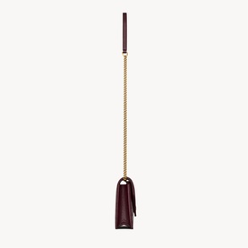 Saint Laurent hot wine leather mini bag with gold-tone chain strap, viewed from above showing compact silhouette and leather handle.