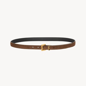 Saint Laurent bark brown leather belt with gold YSL logo buckle, black reverse lining visible at edge