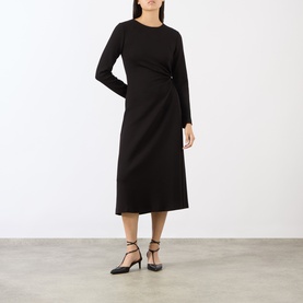 Model wearing MeiMeij nero midi dress with long sleeves and side gather detail, styled with black strappy heels.