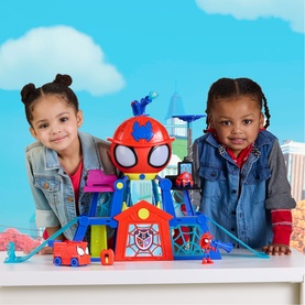 Two children playing with Superheroes multi-coloured Spidey playset featuring tower, web ramp, red vehicle and figures
