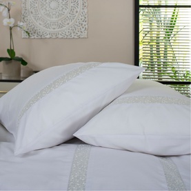 The Lyndon Company Duvet Set in white with delicate embroidered border detail, styled on a bed with matching pillowcases