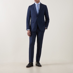 Model wearing Tiger of Sweden Sea blue suit with light blue shirt and black leather dress shoes