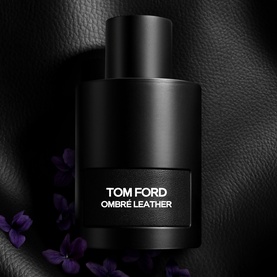 Tom Ford Ombr&eacute; Leather Eau de Parfum gift set, matte black bottle with silver lettering, styled with dark leather and purple florals