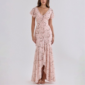 Model wearing House of CB Pink Vintage Rose floral sequin maxi dress with flutter sleeves, V-neckline, and high-low hem