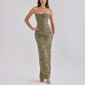 Model wearing House of CB olive strapless maxi dress with floral embellishment and fitted silhouette