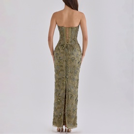 Model wearing House of CB olive strapless maxi dress with lace-up back detail, floral embroidery, and rear split