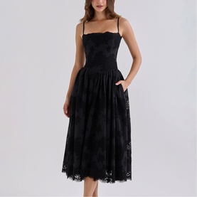 Model wearing House of CB black lace midi dress with spaghetti straps, corseted bodice, and full skirt with scalloped hem