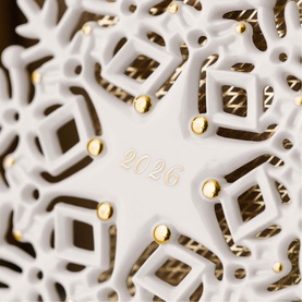 Villeroy & Boch white porcelain snowflake ornament with gold dot details and embossed 2026 date, intricate cut-out geometric pattern