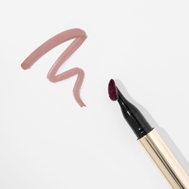 Kash Beauty Lip Tint in Hard To Get, dual-ended pencil with gold barrel, shown with a mauve swatch on white background.