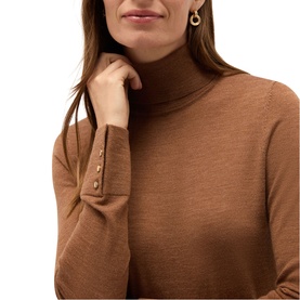 Model wearing Hobbs vicuna marl turtleneck knit top with button cuff detail, styled with gold drop earrings