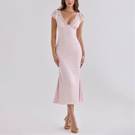 Model wearing House of CB Crystal Pink midi dress with lace cap sleeves, deep V-neckline and fitted silhouette, styled with strappy heels