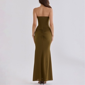 Model wearing House of CB olive strapless maxi dress with ruched back detail and mermaid hem, rear view