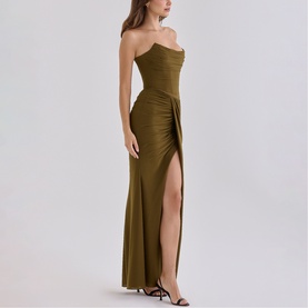 Model wearing House of CB olive strapless maxi dress with ruched bodice, side ruffle detail, and thigh-high split