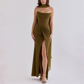 Model wearing House of CB olive strapless maxi dress with ruched waist, thigh-high split, and halterneck detail