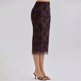Model wearing House of CB chocolate brown lace midi pencil skirt with scalloped hem, styled with gold strappy heeled mules