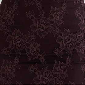 House of CB chocolate brown lace fabric close-up, showing floral lace overlay on bandage-style base