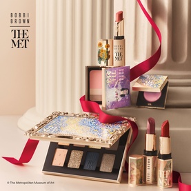Bobbi Brown The Met Eye Shadow Palette gift set with eyeshadow palette, lipsticks, and blush, styled with red ribbon bow