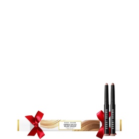 Bobbi Brown Surprise for Eyes Shadow Sticks Holiday Cracker Gift Set with two nude-toned eye pencils displayed beside festive cracker packaging