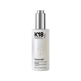 K18 FutureIQ Biomimetic Hair Longevity Serum in a holographic white bottle with silver pump, 90ml