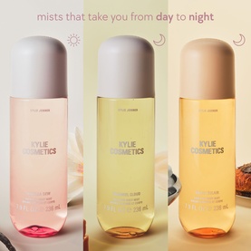 Kylie Cosmetics Vanilla Dew Hair & Body Mist shown in three shades &mdash; pink, yellow, and amber &mdash; with day to night styling campaign visual