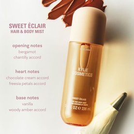 Kylie Fragrance Sweet &Eacute;clair Hair & Body Mist 230ml spray bottle with caramel-toned backdrop and fragrance notes text