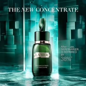 La Mer The Concentrate Serum in deep green glass dropper bottle, shown in promotional campaign shot with teal geometric backdrop.