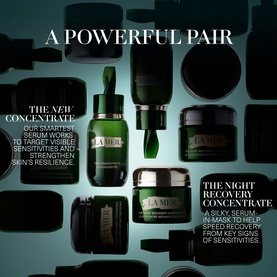 La Mer The Concentrate Serum and Night Recovery Concentrate in dark green glass bottles, arranged as a product duo pairing set