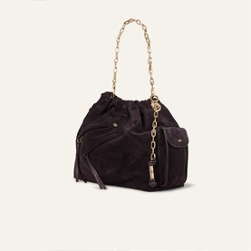 Bash purple suede bucket bag with gold chain strap, tassel zip detail, and front flap pocket