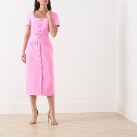 Model wearing FeeG Felicity Belted Pencil Dress in pink, square neck, short sleeves, midi length, button detail, styled with nude heeled sandals