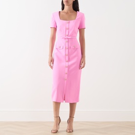 Model wearing FeeG Felicity Belted Pencil Dress in pink, midi length with square neck, short sleeves, and buckled belt. Styled with nude heeled