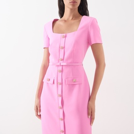 Model wearing FeeG Felicity Belted Pencil Dress in pink with square neck, short sleeves, marbleised buttons and fabric belt.