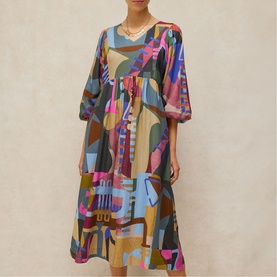 Model wearing White Stuff pink multicolour abstract print midi dress with puff sleeves, drawstring waist, and V-neckline