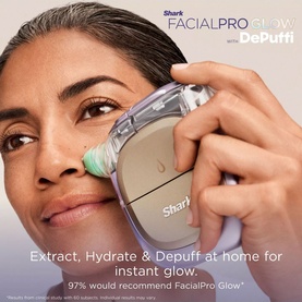 Model with Shark FacialPro Glow with DePuffi device, held against cheek, in gold and clear finish with green attachment