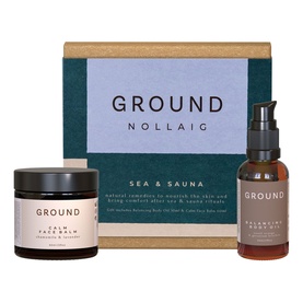 Ground Wellbeing Sea & Sauna Nollaig gift set with Calm Face Balm jar and Balancing Body Oil bottle in kraft gift box