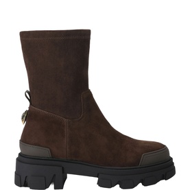 Kurt Geiger London brown suede chunky-sole ankle boots with gold back charm detail and black lug sole, side profile view.