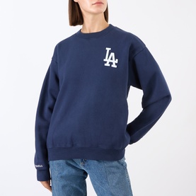 Model wearing Sporty and Rich Dark Navy White LA Dodgers cotton crew neck sweat top, styled with light blue jeans.
