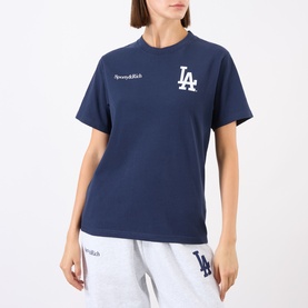 Model wearing Sporty and Rich Dark Navy White LA Dodgers graphic T-shirt, styled with matching grey logo joggers.