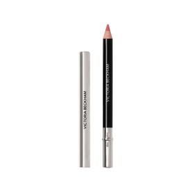 Victoria Beckham Lip Definer nude-pink lip liner pencil shown with silver cap, product packaging displayed alongside