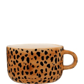 Anna + Nina mug in tan with black leopard print spot pattern, cream interior, and looped handle.