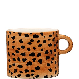Anna + Nina ceramic mug in tan with black leopard spot print pattern and loop handle